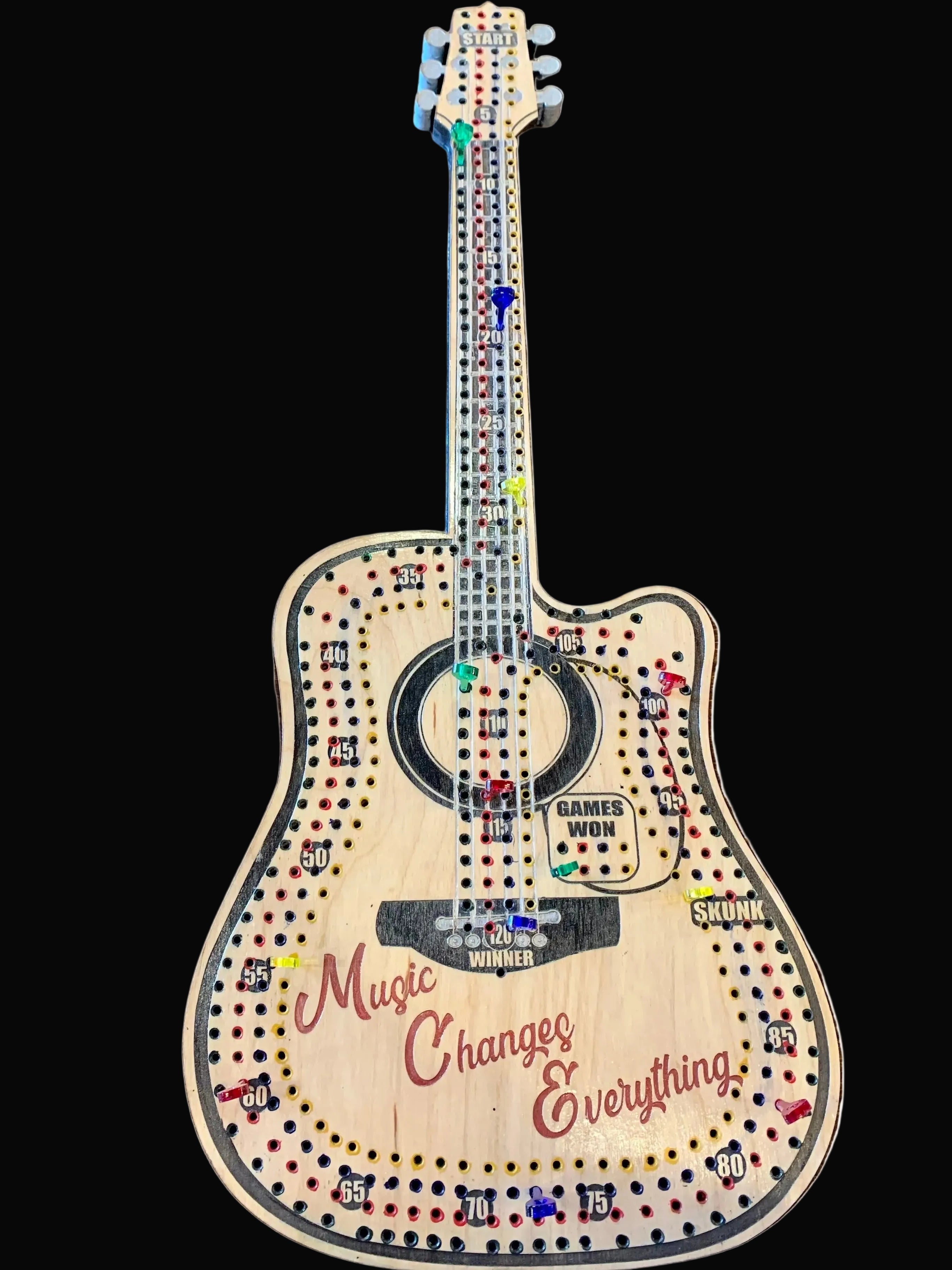 Wooden guitar-shaped cribbage board with 'Music Changes Everything' text.