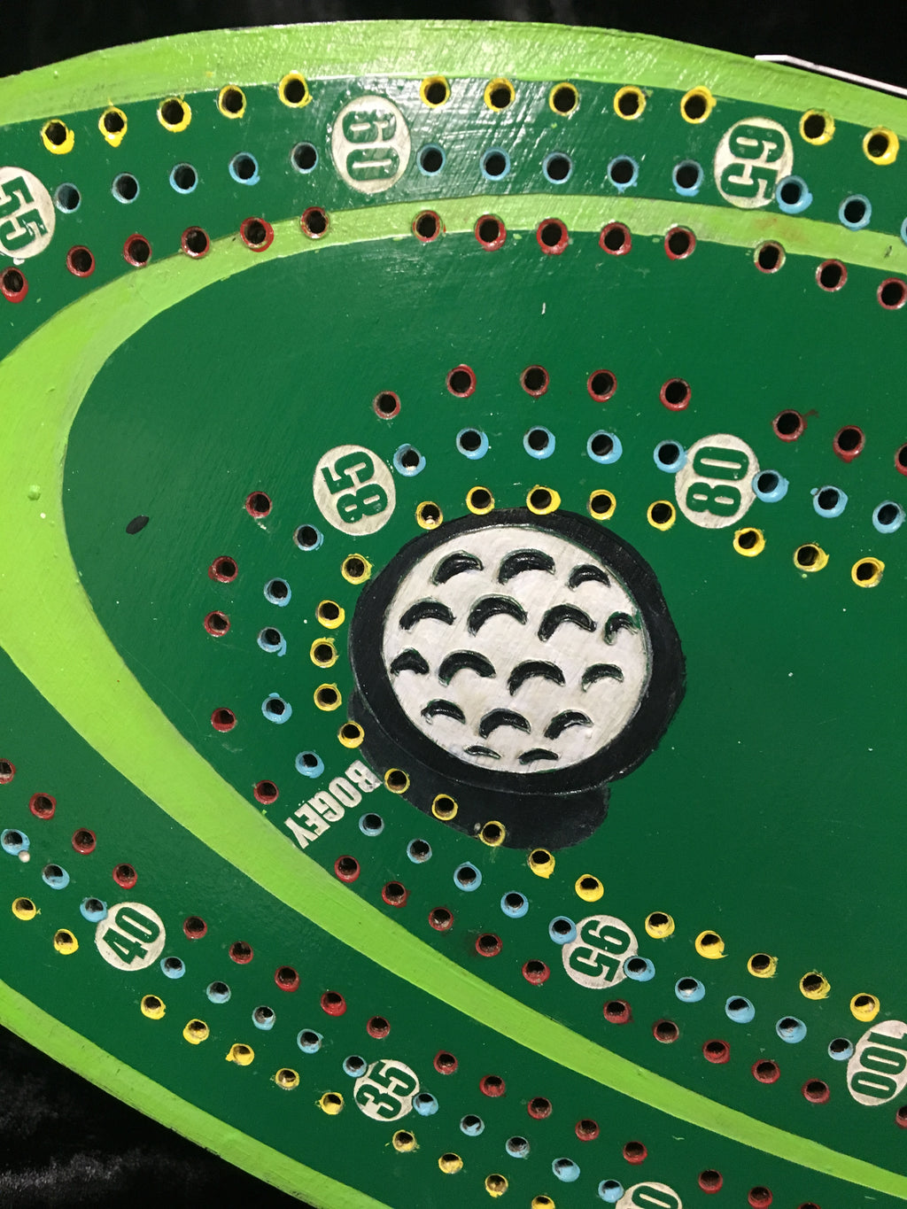 Golf themed cribbage board with acrylic pegs.