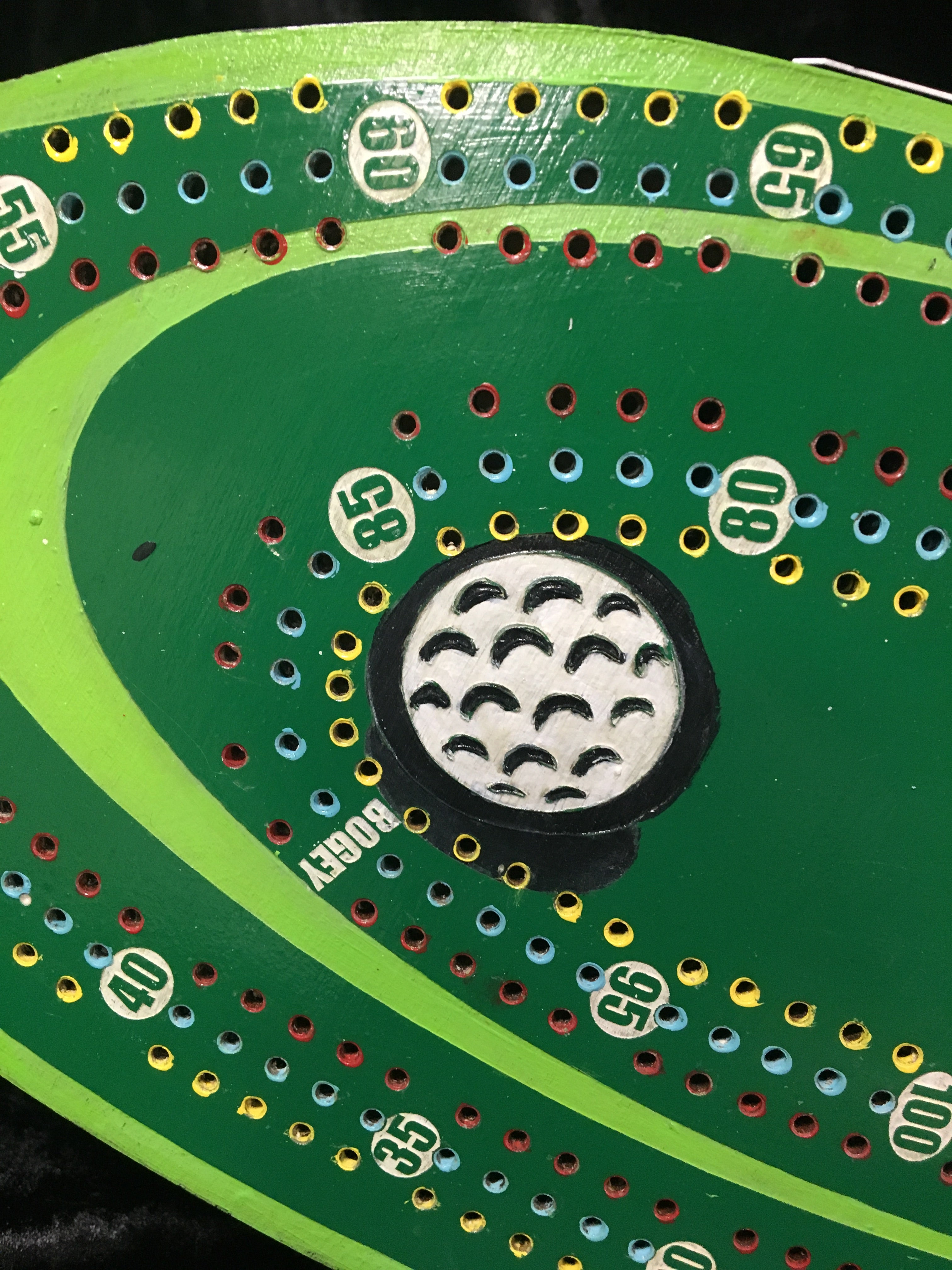 Golf themed cribbage board with acrylic pegs.