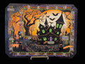 Halloween-themed decorative board with bats and a haunted house.