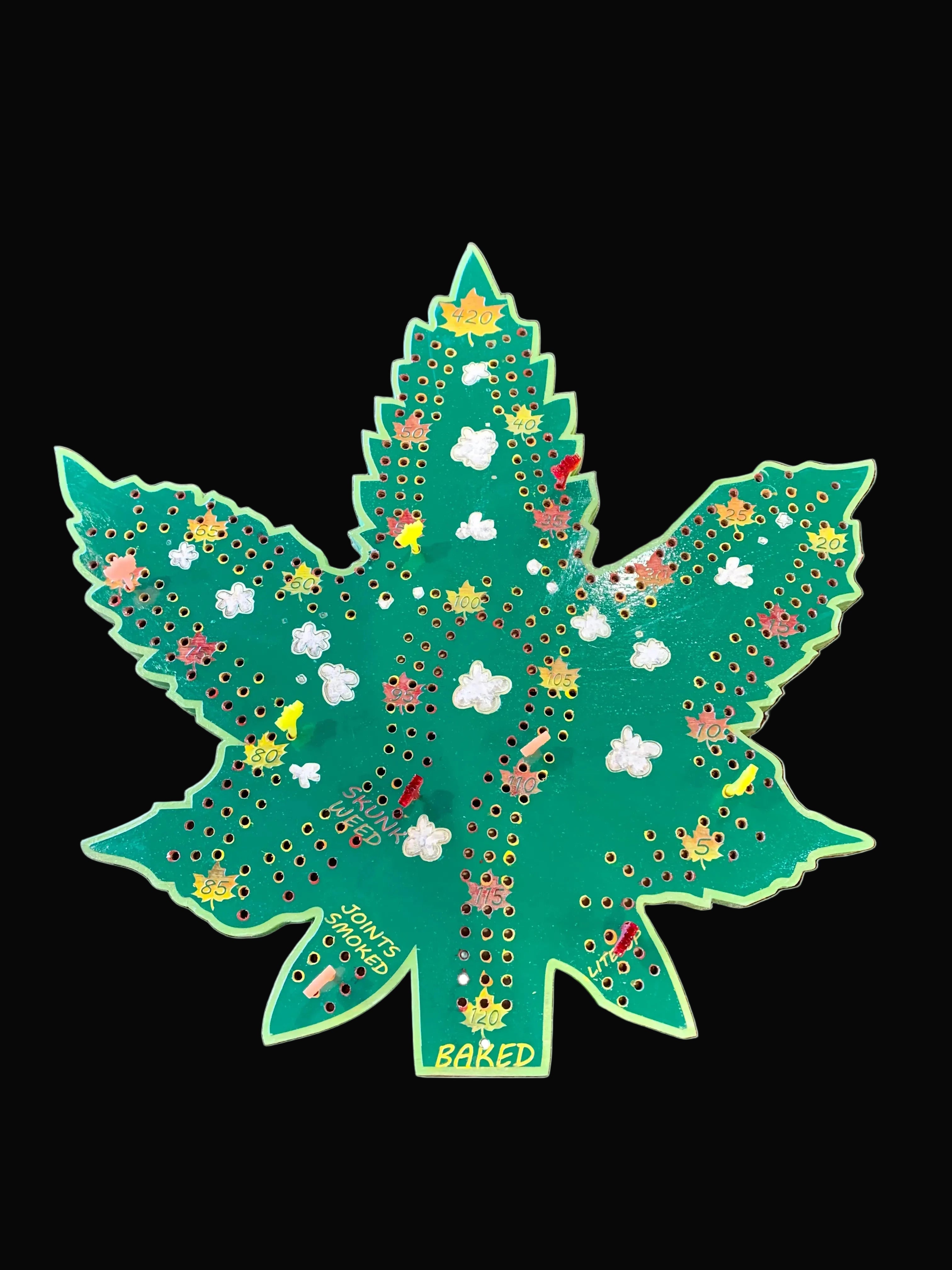 Decorative cannabis leaf cribbage board.